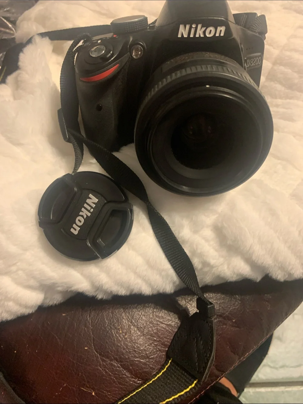 Nikon DSLR Camera in Black with Lens and Strap
